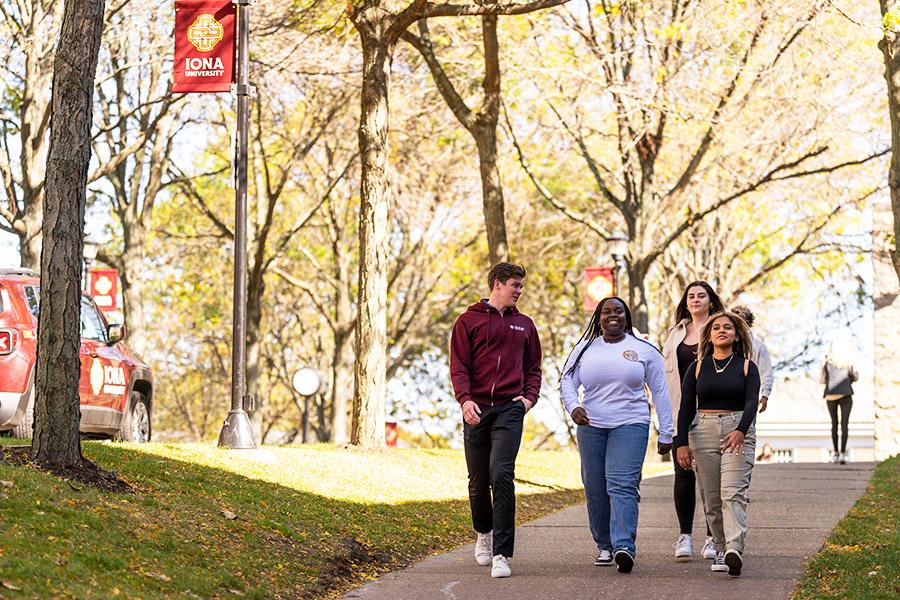 Students walk on campus near the North Ave. entrance.