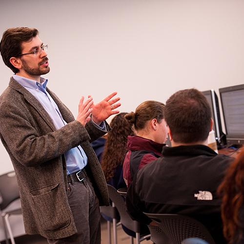 Dr. TJ Moretti teaching a class in a computer lab.