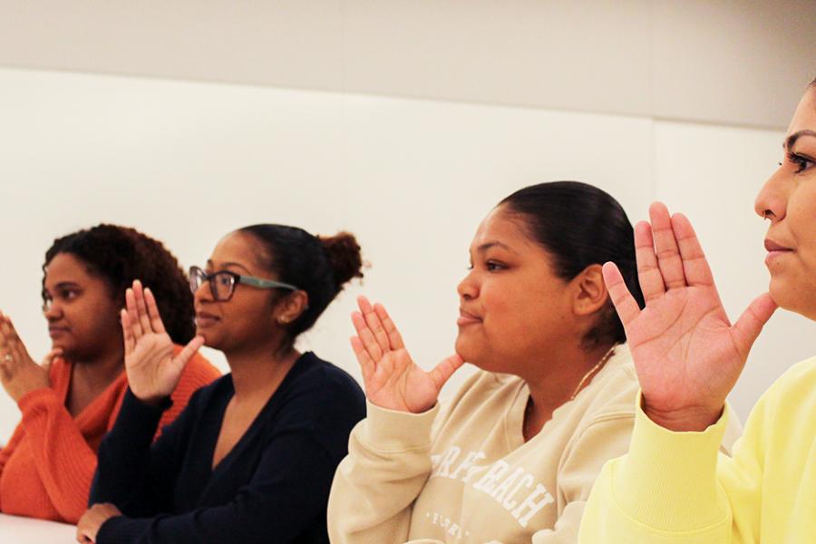 Four IACD students practice in class.