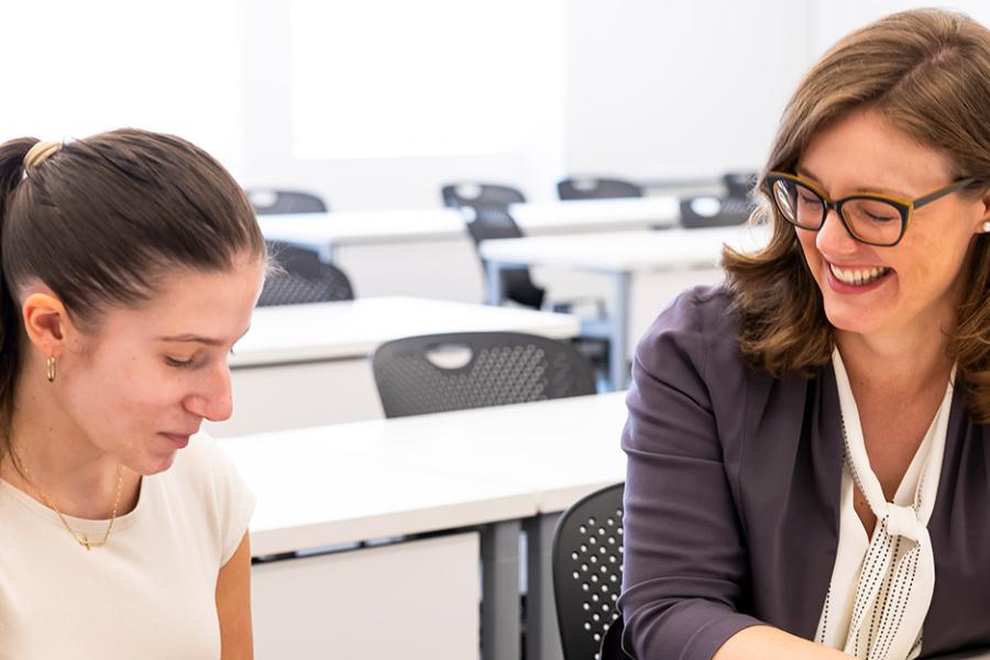 Christine Hardigree works with a student and smiles.