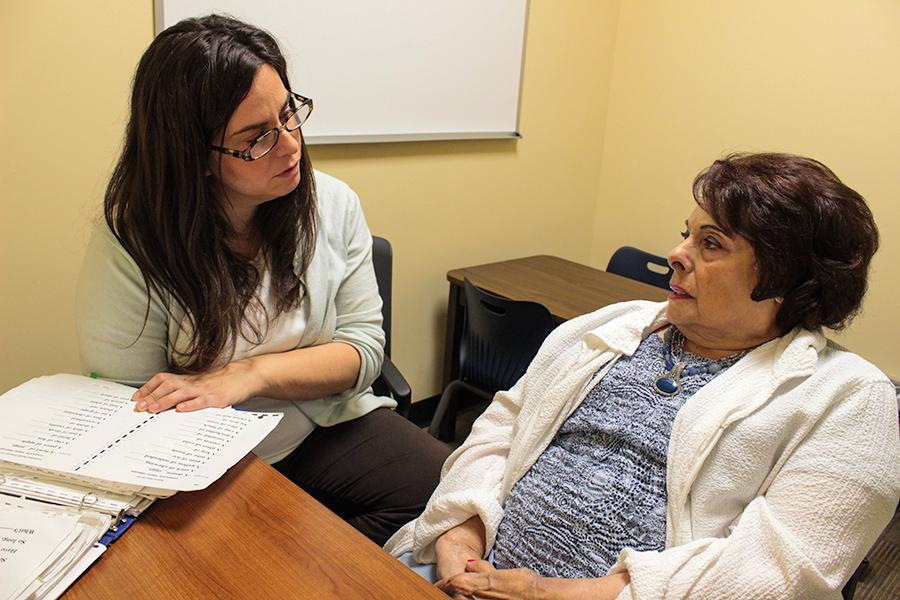 A social worker works with one of her clients.