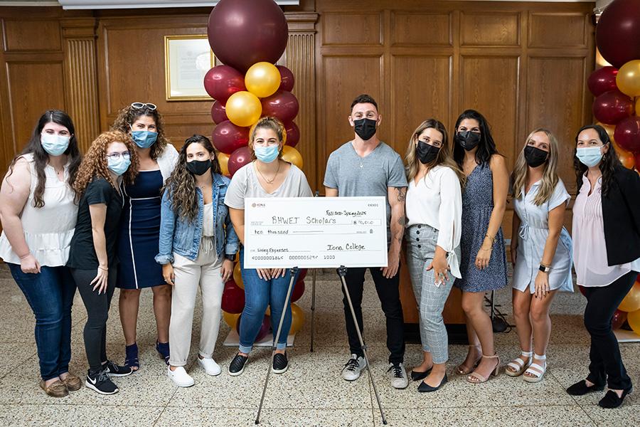 Students pose with the BHWET check.