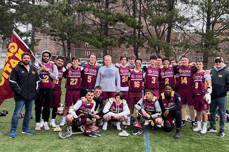 The Iona men's lacrosse club team pose on the field after a game.