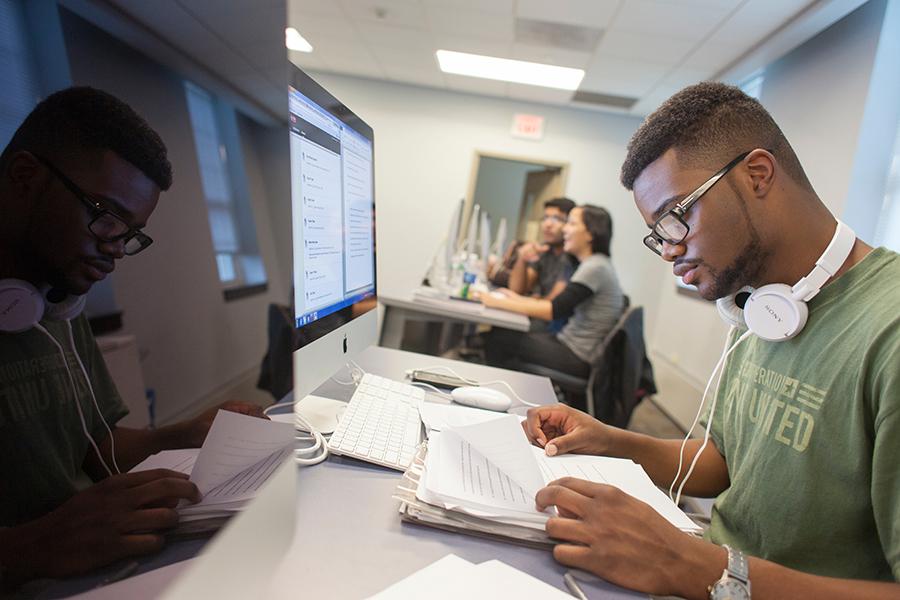 A student works on homework in the computer lab.