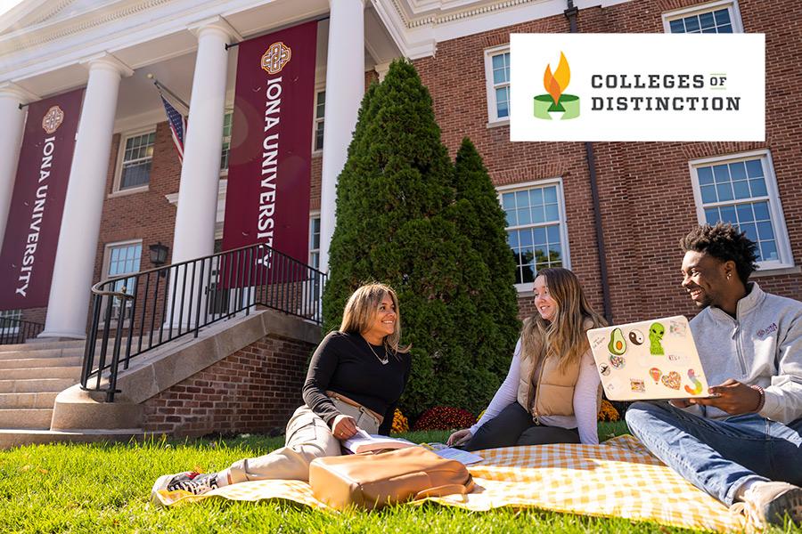 Three students sit outside McSpedon hall and the Colleges of Distinction logo.