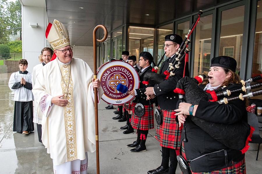 Cardinal Dolan greeting the pipers at the 2023 Archdioses Spirituality day.