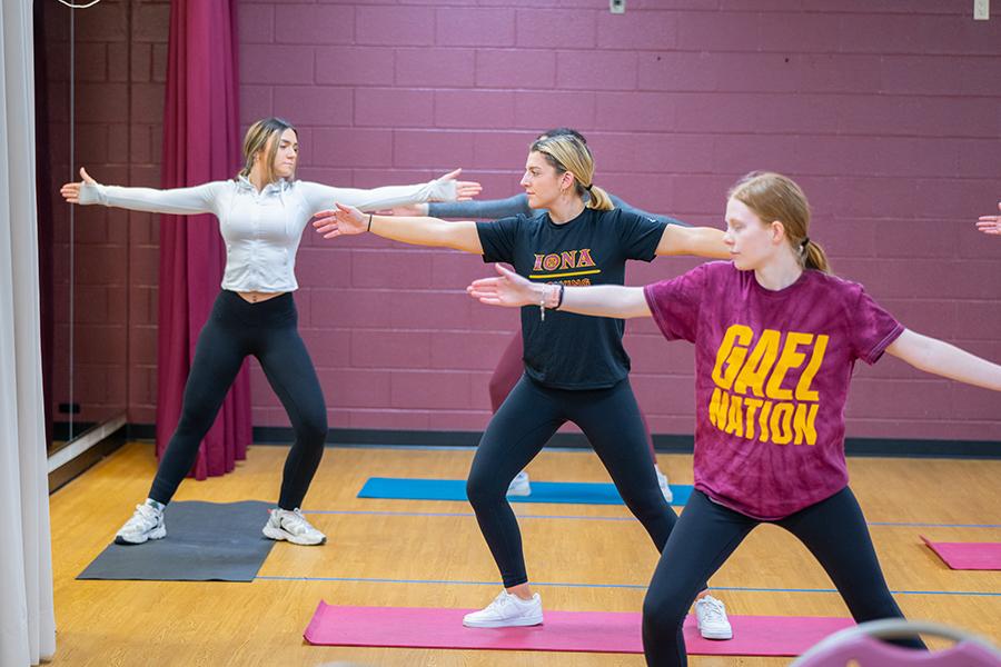 Students practice yoga in the Hegarty Room.