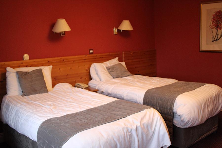 Twin beds at a room in Boffin Lodge.