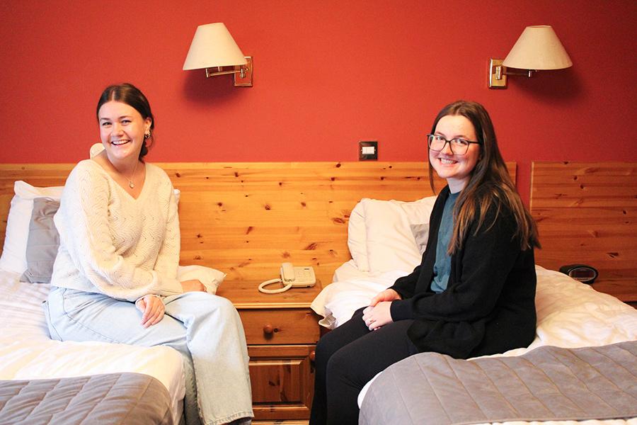 Two students smile in their room at Boffin Lodge.