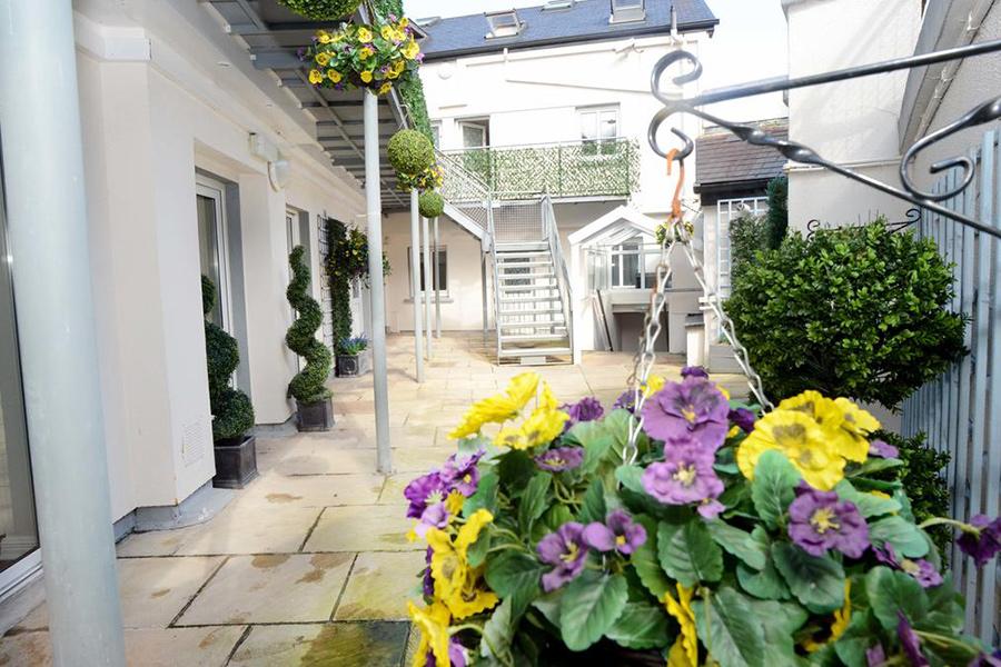 The courtyard at The Helm with flowers.