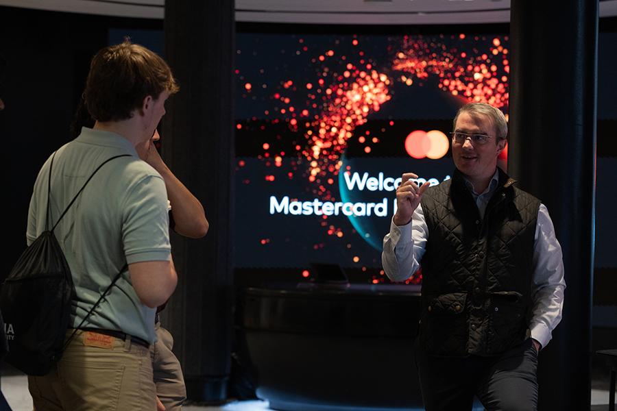 An employee speaks to students at Mastercard.