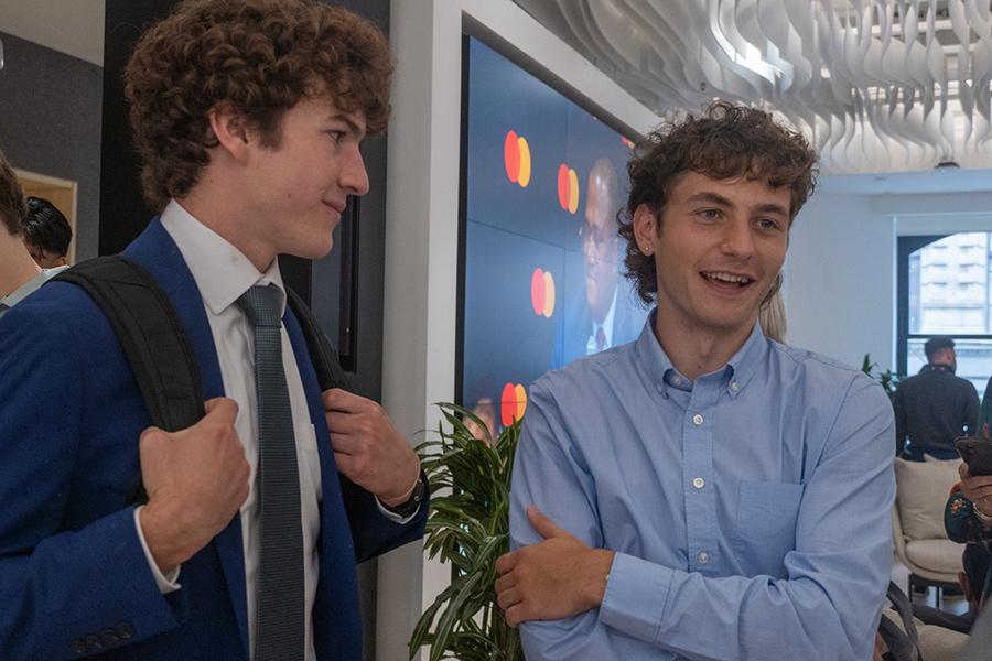 Two students have a conversation at Mastercard.