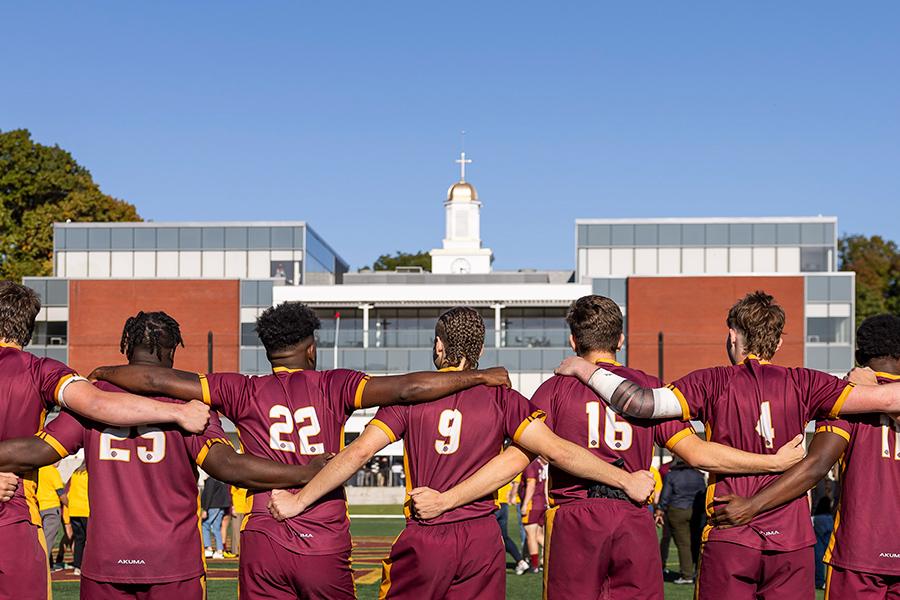 The rugby team on Mazzella Field in front of LSB.