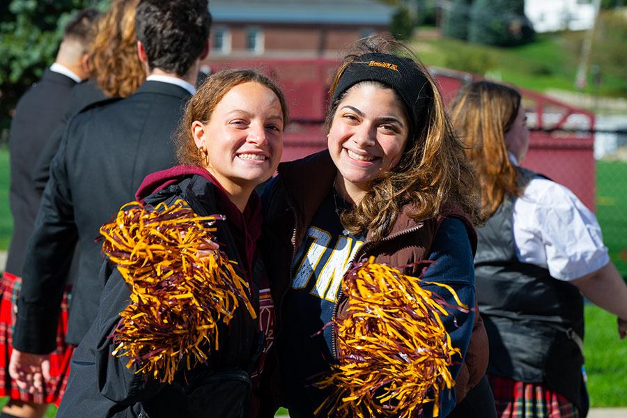 Two female Iona students posing for photo during spirit day