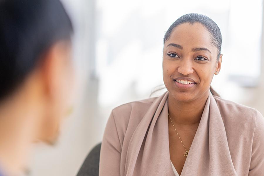 A social worker has a session with a client.