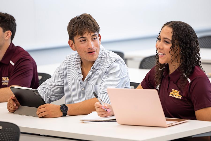 Students work together in a management class.