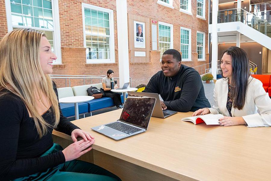 Students working together in the atrium of the LSB.