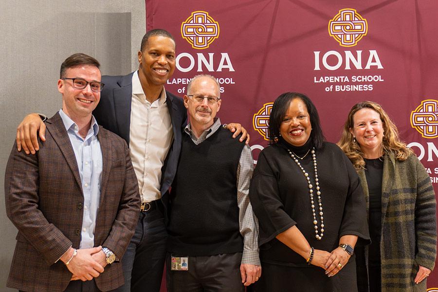 Mandell Crawley with Iona administration.