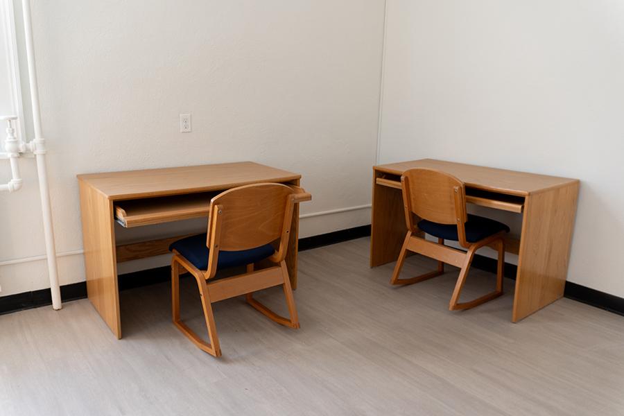 Two desks in a room in Bohm Hall.