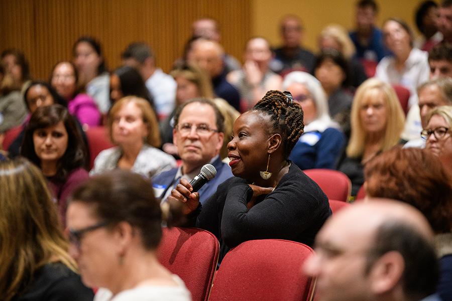 An audience member asks a question at the conference.