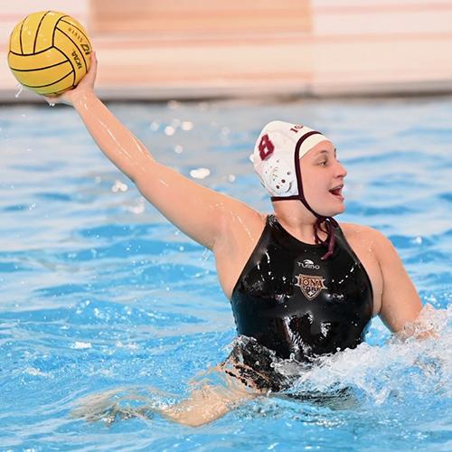 Malia Naugle throwing the water polo ball.