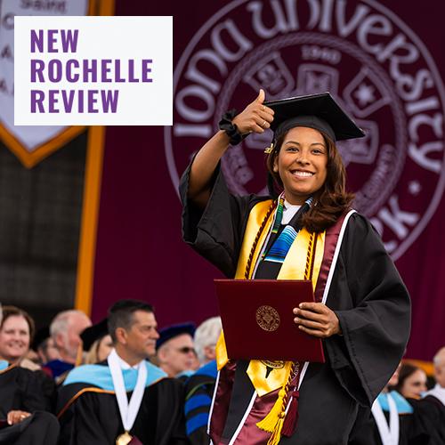 A graduate gives the thumbs up as she walks across the commencement stage. New Rochelle Review logo in the corner.
