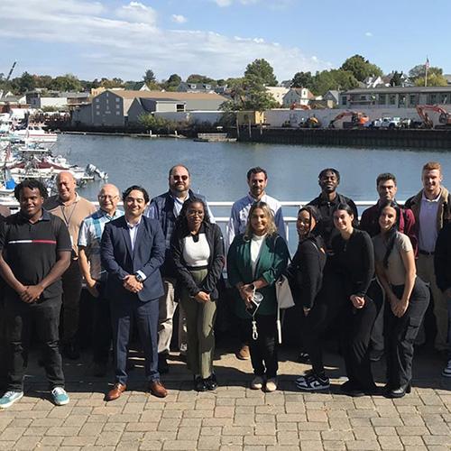 The 2024 WIN City Labs Port Chester Project members and Iona Students in front of the harbor.