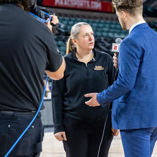 An Iona student interviewing the WBB coach.