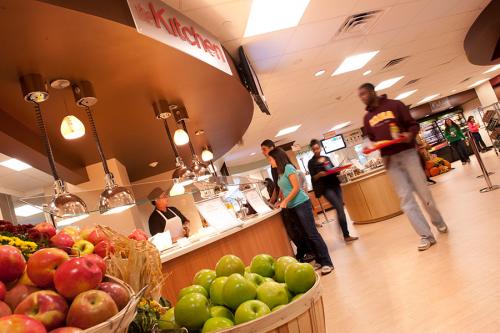 Students pick out their lunches at Vitanza Commons which has fresh fruit including different kinds of apples.