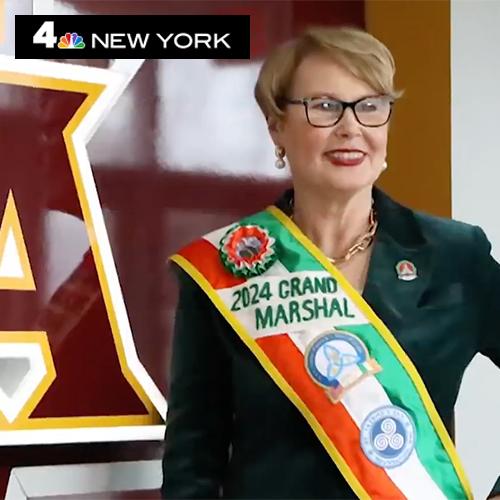 Maggie Timoney with the Grand Marshal sash and NBC New York logo