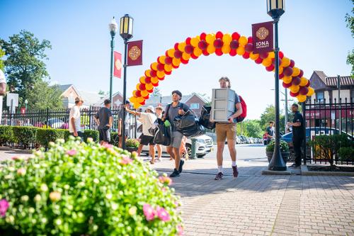 Students bring in their belongings on move-in day.