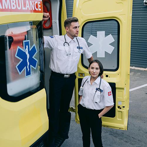 An ambulance and two EMTs.