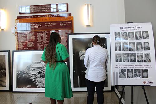 People visit the John Botte 9/11 photo exhibit.