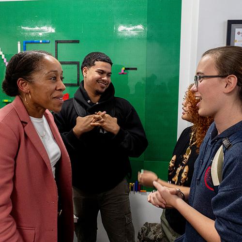 Mayor Ramos-Herbert speaking to a student.