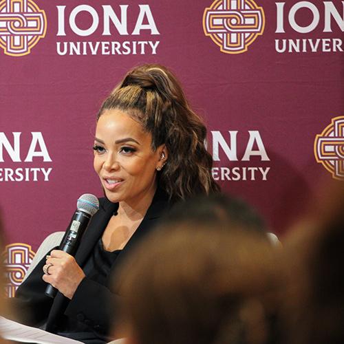 Sunny Hostin speaking into a microphone at the event.