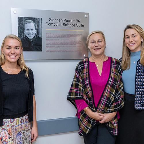 The Powers family with the plaque dedicated to their son.