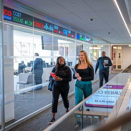 Students walk to class in the LaPenta School of Business.