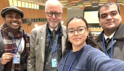 Iona students Mekias Assefa, Sarhay Acosta, and Adrian Vazquez with Br. Kevin Cawley, CFC, of Edmund Rice International at United Nations Headquarters in New York.