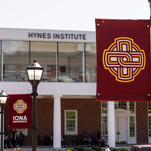 The Hynes Institute with an Iona banner in the foreground.