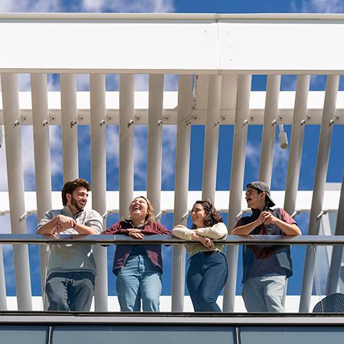 Students smile on the terrace of LSB.