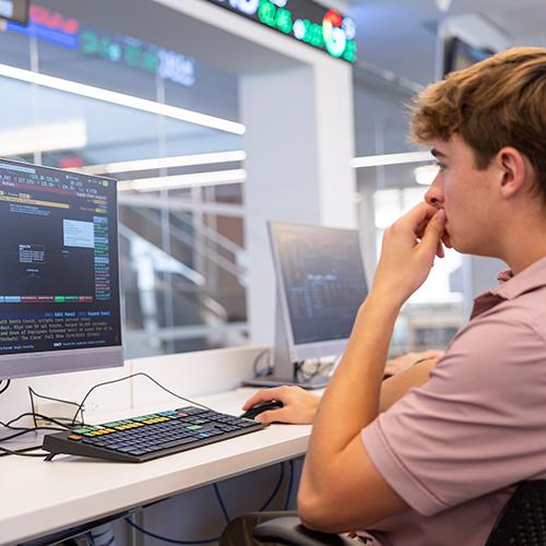 A student working at a Bloomberg terminal.