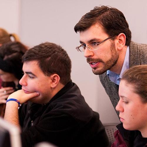 Dr. Moretti teaching students in the computer lab.