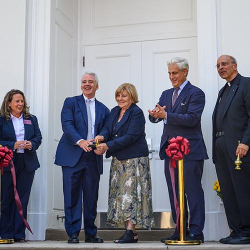Iona leadership, a priest and the Gabelli family cut the ribbon.